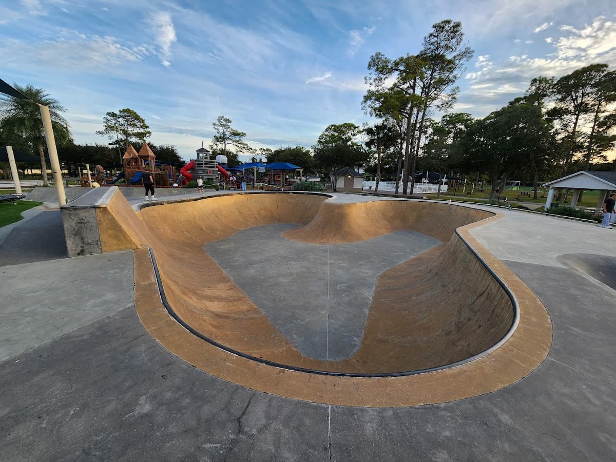 South Beach Skatepark — concrete bowl with skate features and playground in background